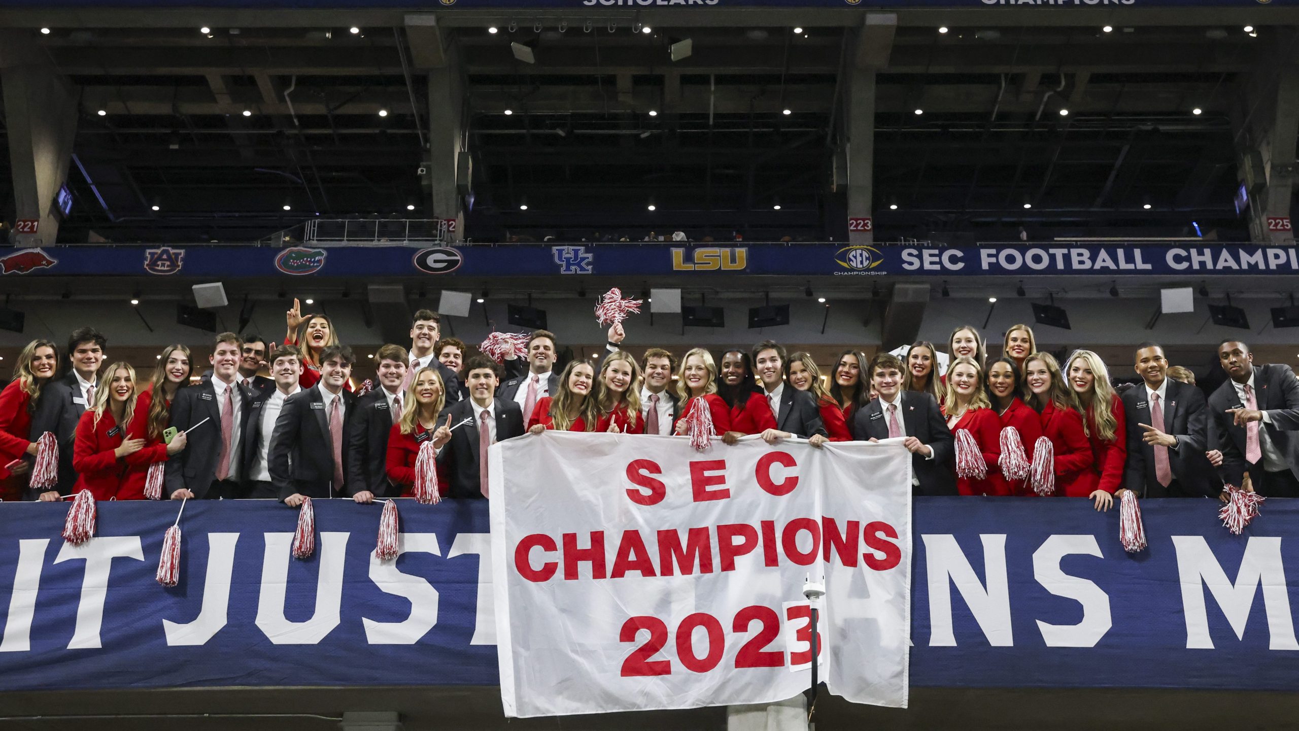 Capstone Men and Women in the crowd cheering at 2023 SEC Championship game 2023